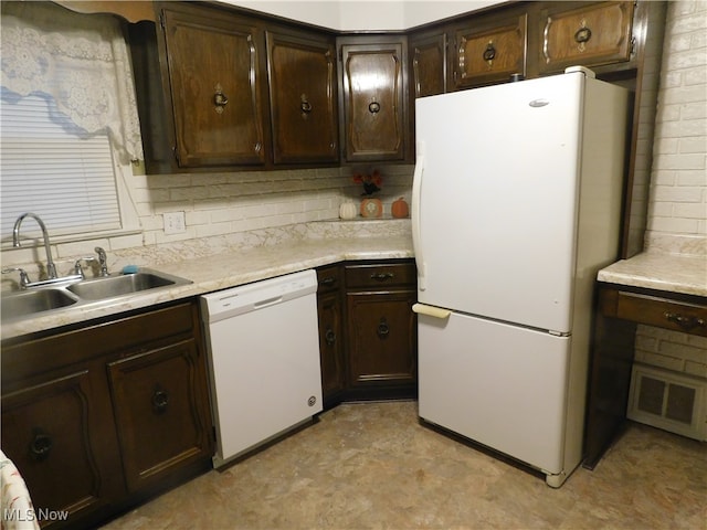 kitchen featuring white appliances, backsplash, dark brown cabinetry, and sink