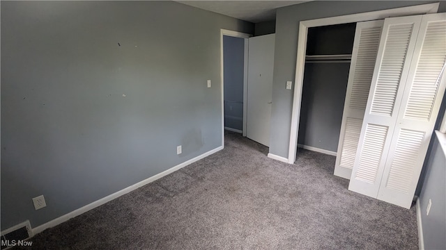 unfurnished bedroom featuring a closet and carpet floors