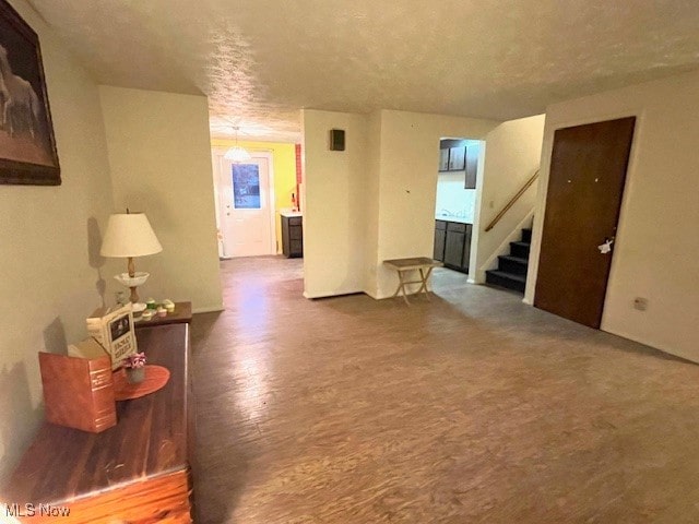 living room featuring hardwood / wood-style floors and a textured ceiling