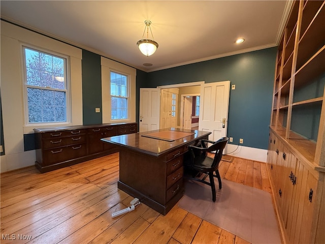 home office with light hardwood / wood-style floors and crown molding