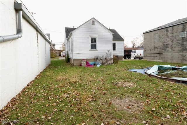 rear view of house with a lawn