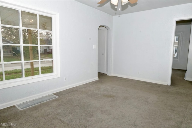 unfurnished room with ceiling fan and carpet floors