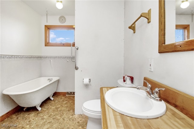 bathroom featuring toilet, a bathtub, and sink