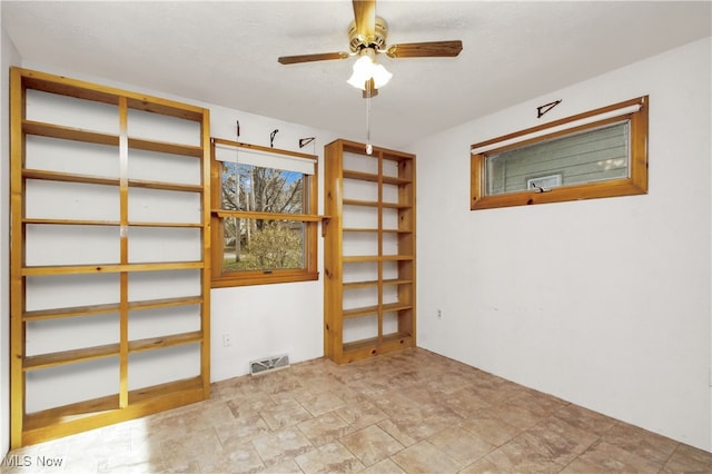 spare room featuring ceiling fan