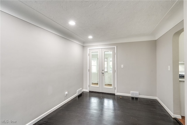 doorway to outside with a textured ceiling, french doors, and dark hardwood / wood-style floors