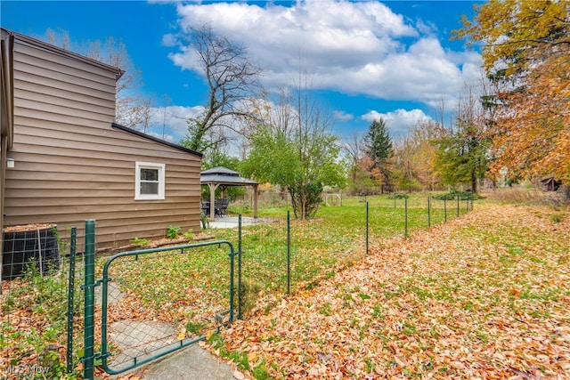 view of yard featuring a gazebo and central air condition unit