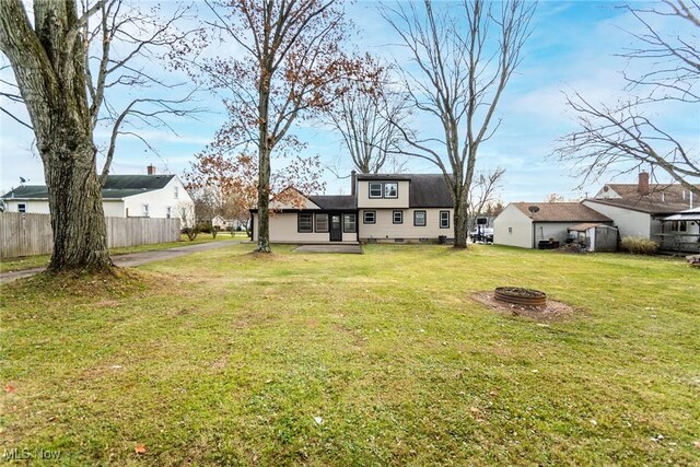 view of yard with an outdoor fire pit