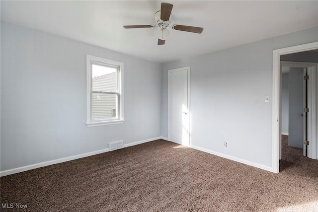 unfurnished bedroom featuring carpet, ceiling fan, and a closet