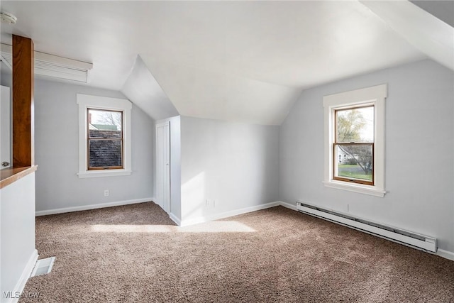 bonus room with carpet floors, a baseboard radiator, vaulted ceiling, and plenty of natural light