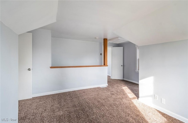 additional living space featuring carpet floors