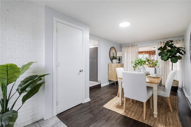 dining space featuring dark hardwood / wood-style floors