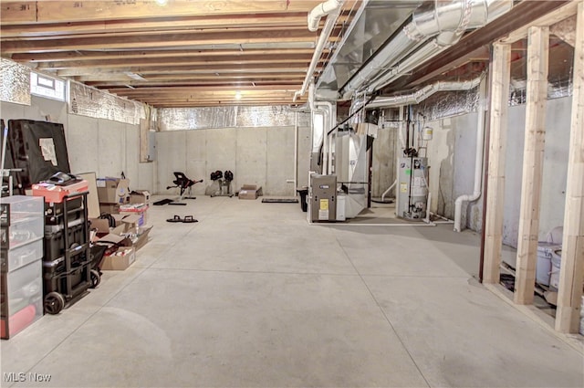 basement featuring heating unit and gas water heater