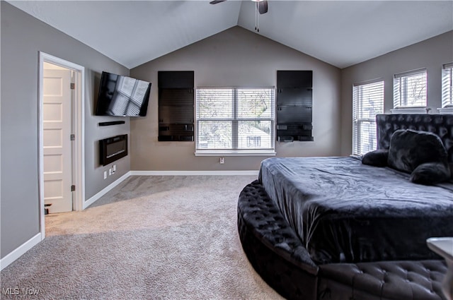 bedroom with ceiling fan, lofted ceiling, and carpet floors