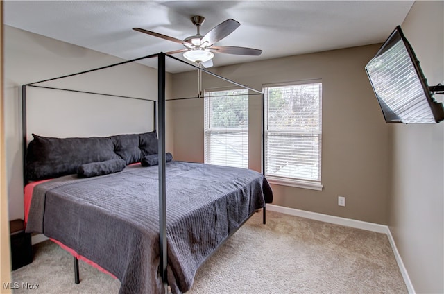 bedroom featuring ceiling fan and light colored carpet