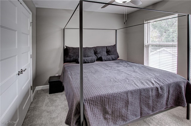 bedroom with light carpet and ceiling fan