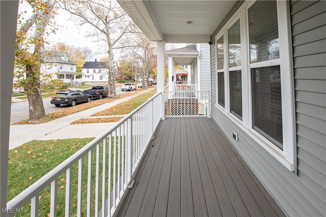 wooden terrace featuring a porch