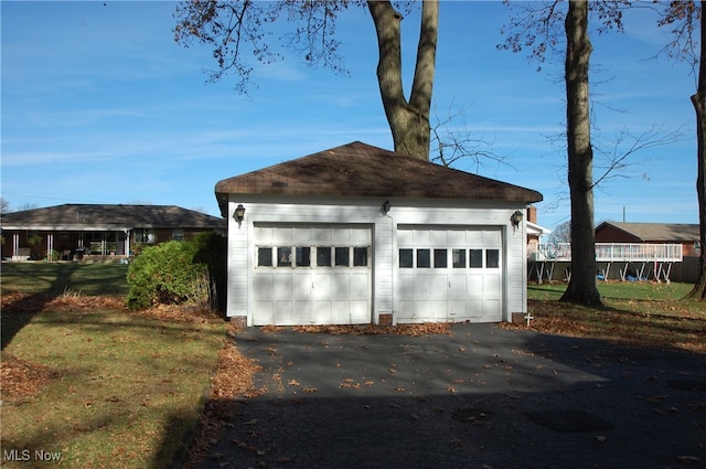 garage featuring a lawn