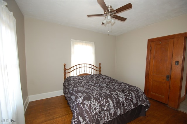 bedroom featuring dark hardwood / wood-style floors and ceiling fan