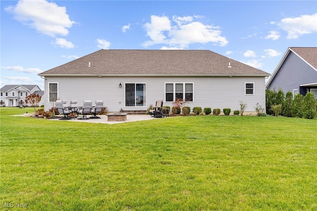 back of house featuring a yard and a patio