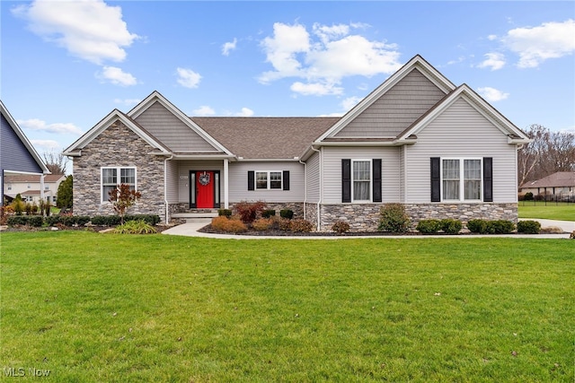 craftsman-style home with a front yard