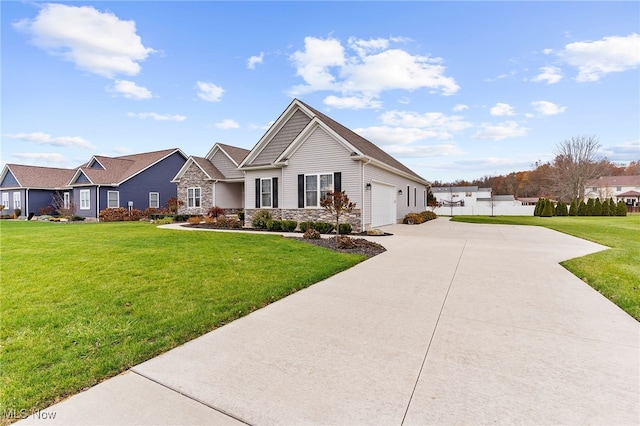 view of front of property featuring a front lawn and a garage