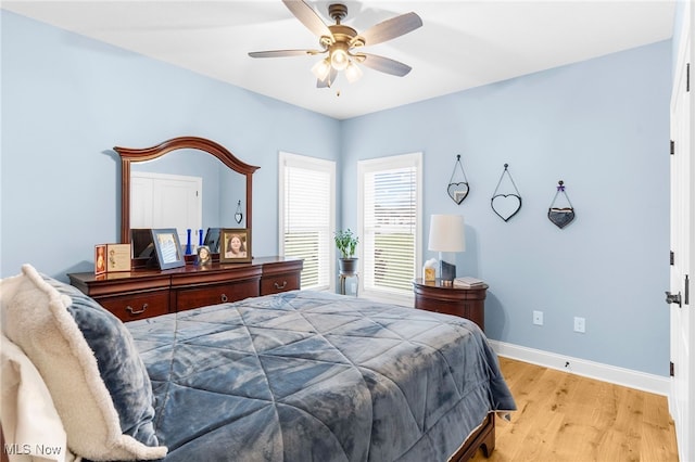 bedroom featuring ceiling fan and light hardwood / wood-style floors