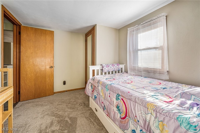 bedroom featuring light colored carpet