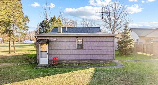 view of side of home featuring a yard