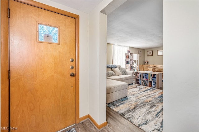 entrance foyer featuring hardwood / wood-style flooring