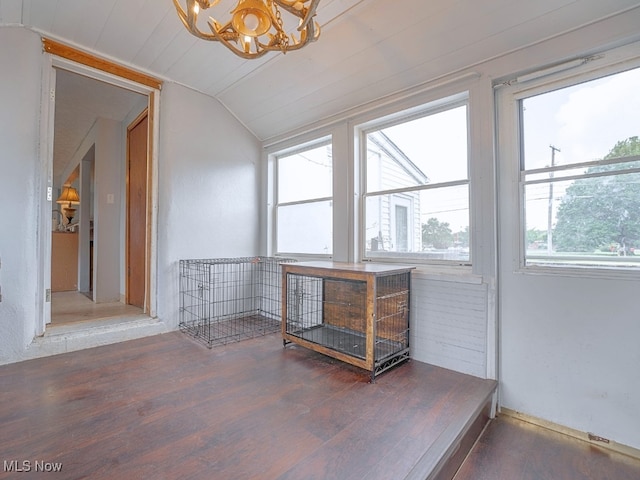 interior space with a healthy amount of sunlight, lofted ceiling, and wood ceiling