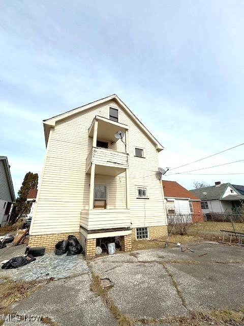 rear view of house with a balcony