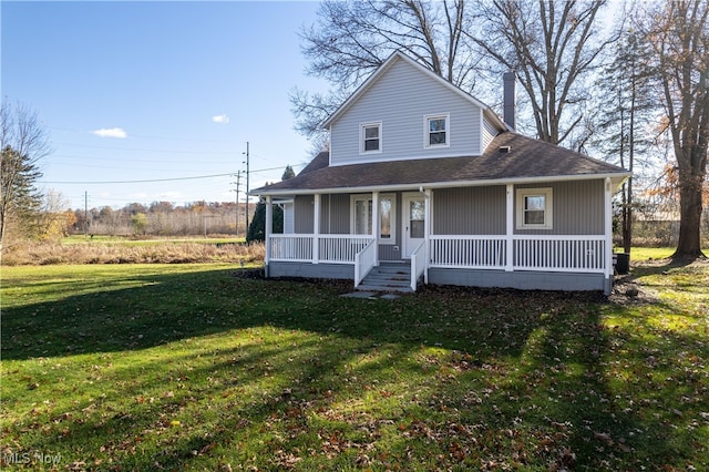 farmhouse-style home with a front lawn and a porch