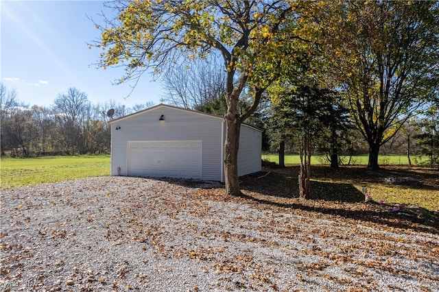 view of property exterior with an outbuilding and a garage