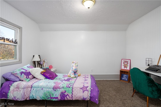 carpeted bedroom featuring a textured ceiling and vaulted ceiling