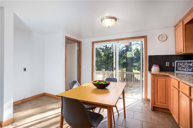 dining area with light tile patterned floors