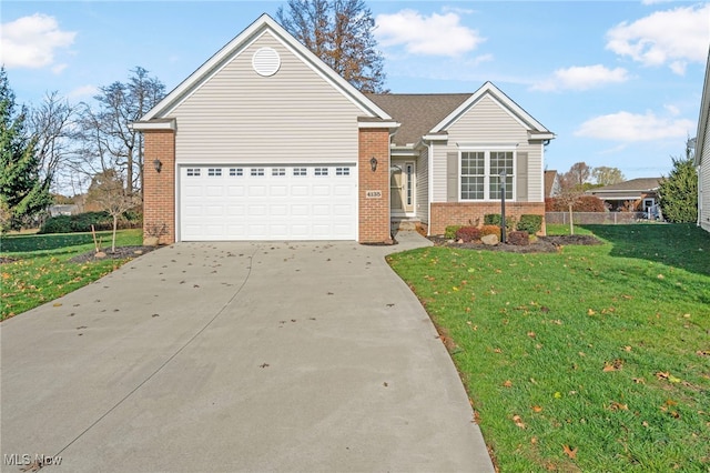 view of front of home featuring a garage and a front lawn