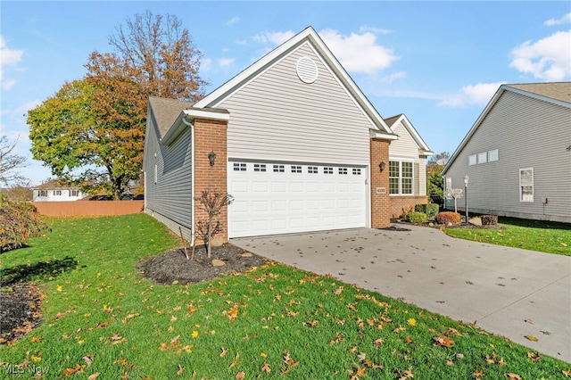 view of home's exterior with a yard and a garage