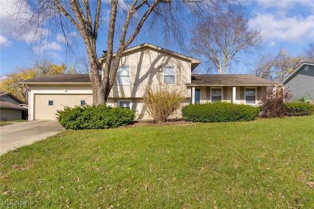 tri-level home with a front lawn and a garage