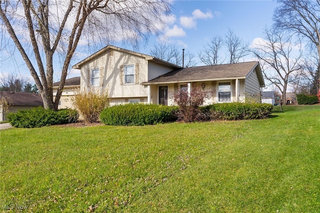 tri-level home with a front lawn