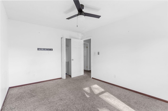 unfurnished bedroom featuring ceiling fan and carpet floors