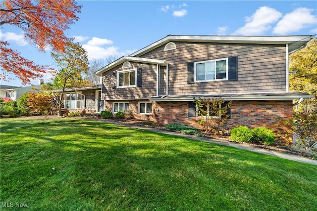 tri-level home with a front yard