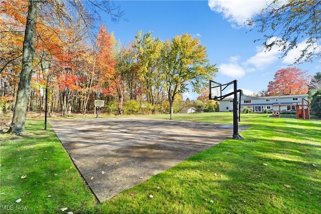 view of basketball court featuring a lawn