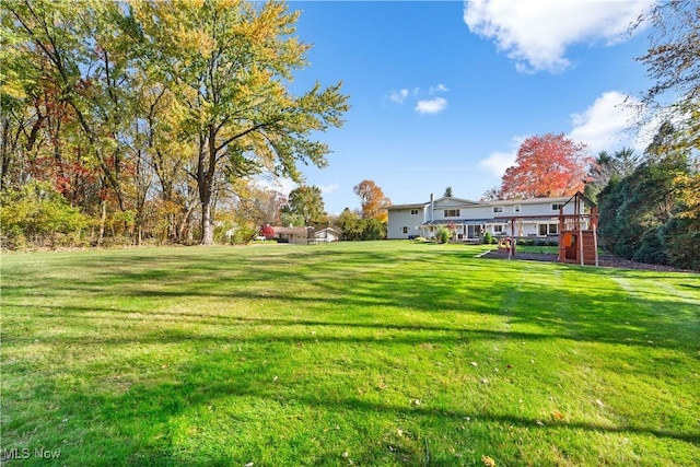 view of yard with a wooden deck