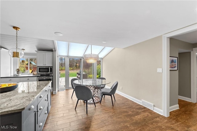 dining space featuring hardwood / wood-style floors