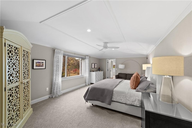 carpeted bedroom featuring crown molding and ceiling fan