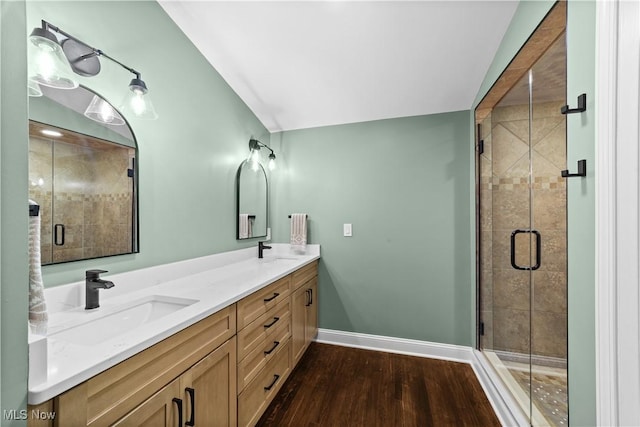 bathroom featuring vanity, hardwood / wood-style floors, and walk in shower