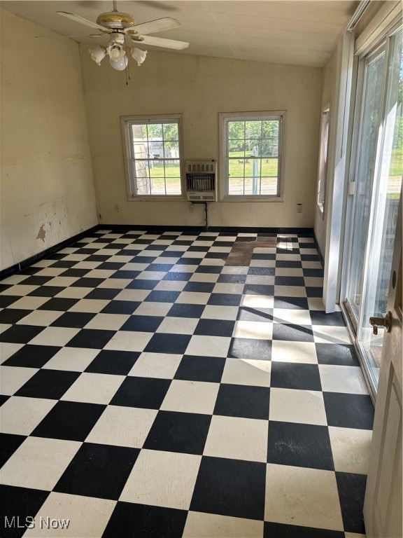 empty room featuring ceiling fan and heating unit