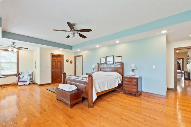 bedroom with light wood-type flooring and ceiling fan