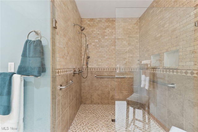 bathroom featuring a tile shower