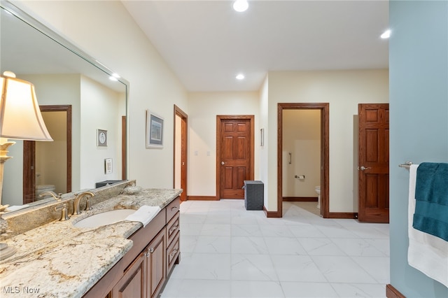 bathroom with vanity and toilet